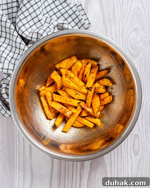 Coating the fries.