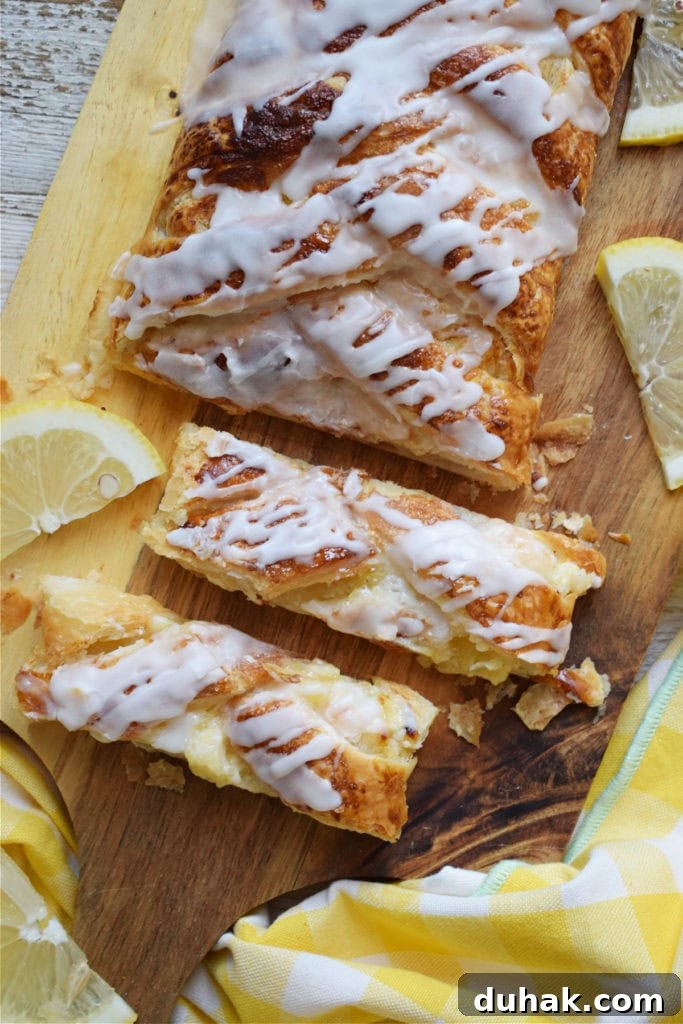 Lemon Cream Cheese Danish Recipe: Flaky Pastry with Zesty Filling 3 lemon cream cheese danish on a serving board