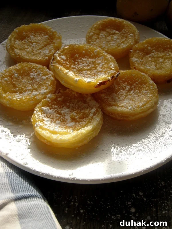 Lemon Cream Cheese Danish Recipe: Flaky Pastry with Zesty Filling 25 lemon tarts on a plate