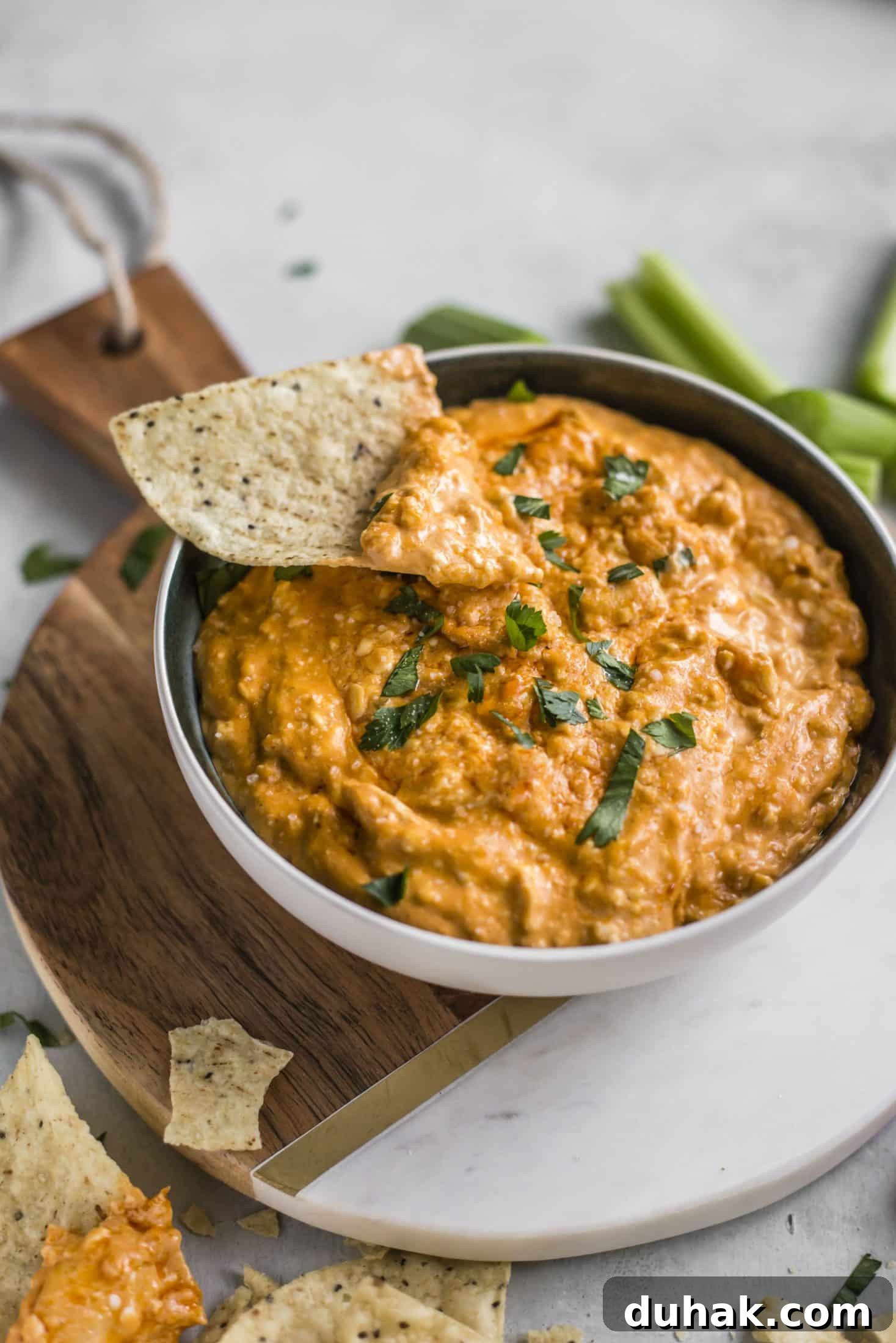 This is the best buffalo chicken dip recipe! Creamy, cheesy, slightly spicy and full of delicious chicken and flavors. Perfect for tailgating, football games, parties and weekends. This recipe is classic and super easy to make. I howsweeteats.com #buffalo #chicken #dip #recipe