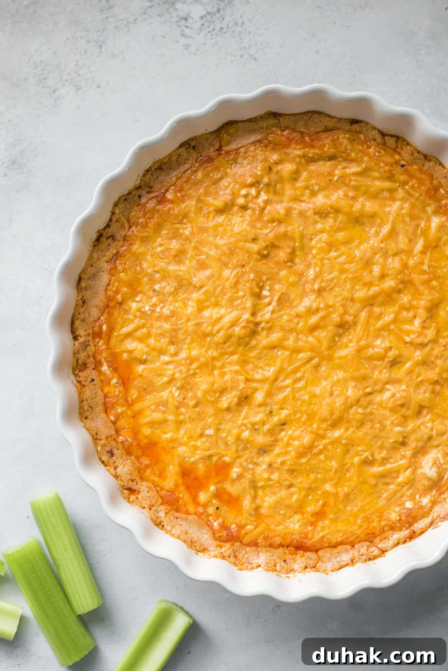 This is the best buffalo chicken dip recipe! Creamy, cheesy, slightly spicy and full of delicious chicken and flavors. Perfect for tailgating, football games, parties and weekends. This recipe is classic and super easy to make. I howsweeteats.com #buffalo #chicken #dip #recipe