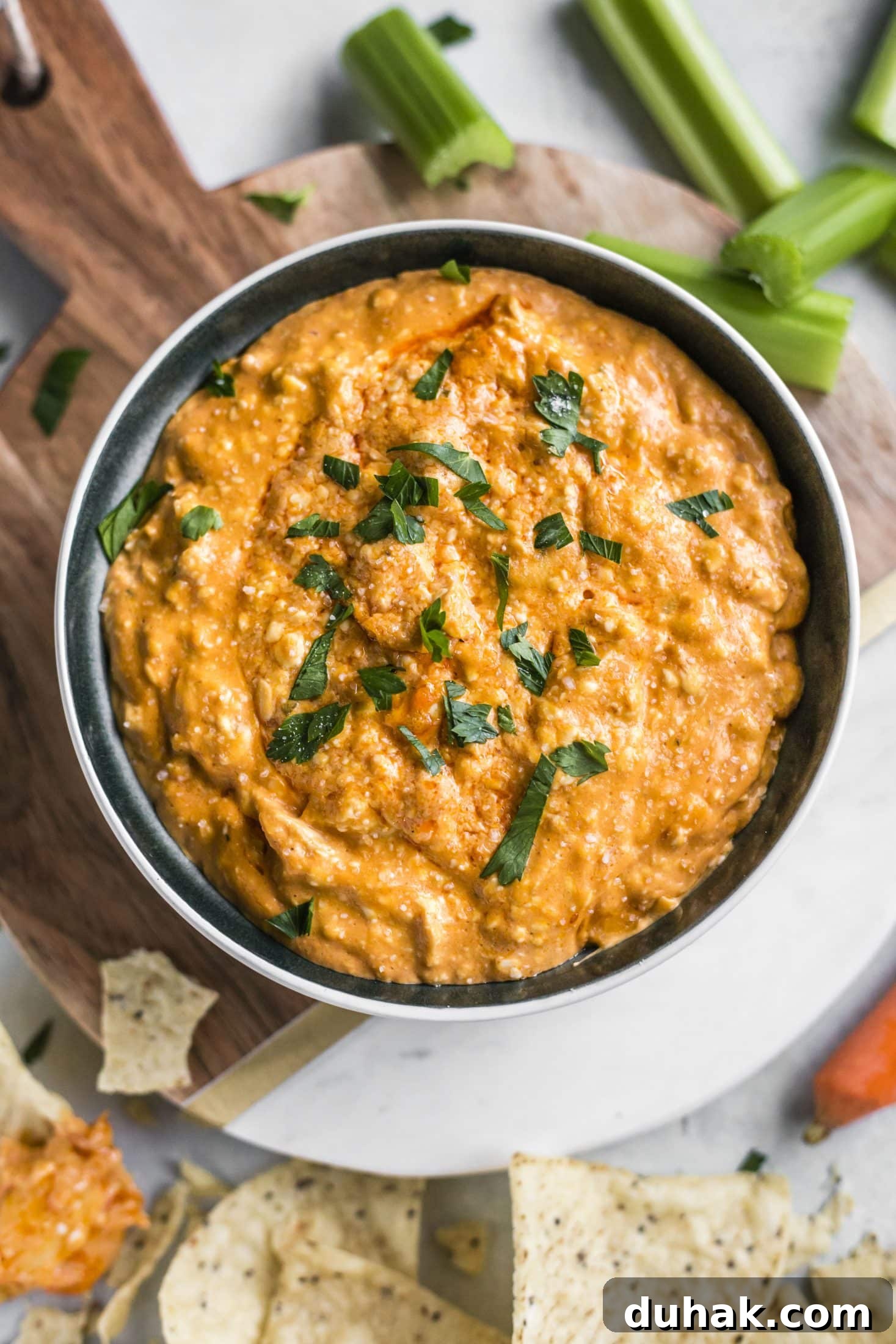 This is the best buffalo chicken dip recipe! Creamy, cheesy, slightly spicy and full of delicious chicken and flavors. Perfect for tailgating, football games, parties and weekends. This recipe is classic and super easy to make. I howsweeteats.com #buffalo #chicken #dip #recipe