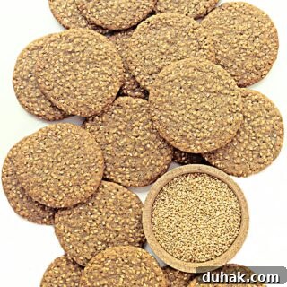 Flat, round sesame cookies.