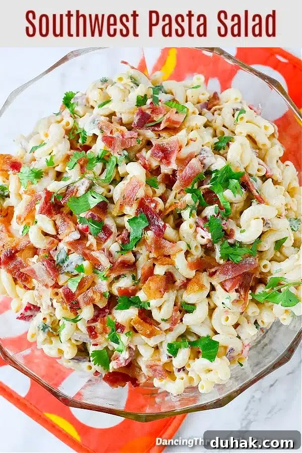 a bowl of southwest pasta salad with bacon and chipotle dressing. 