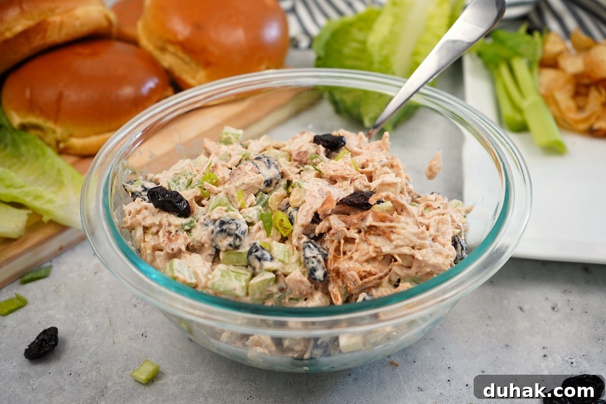 Cherry chicken salad in glass bowl.