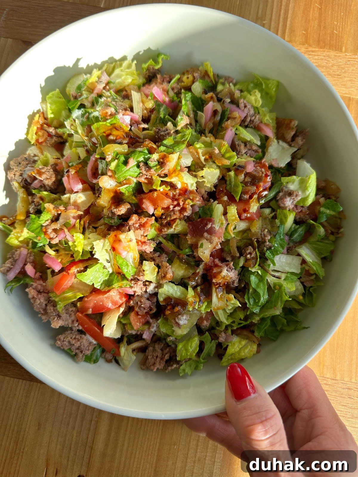 Chopped Burger Salad with burger patty, romaine, arugula and pickled onions