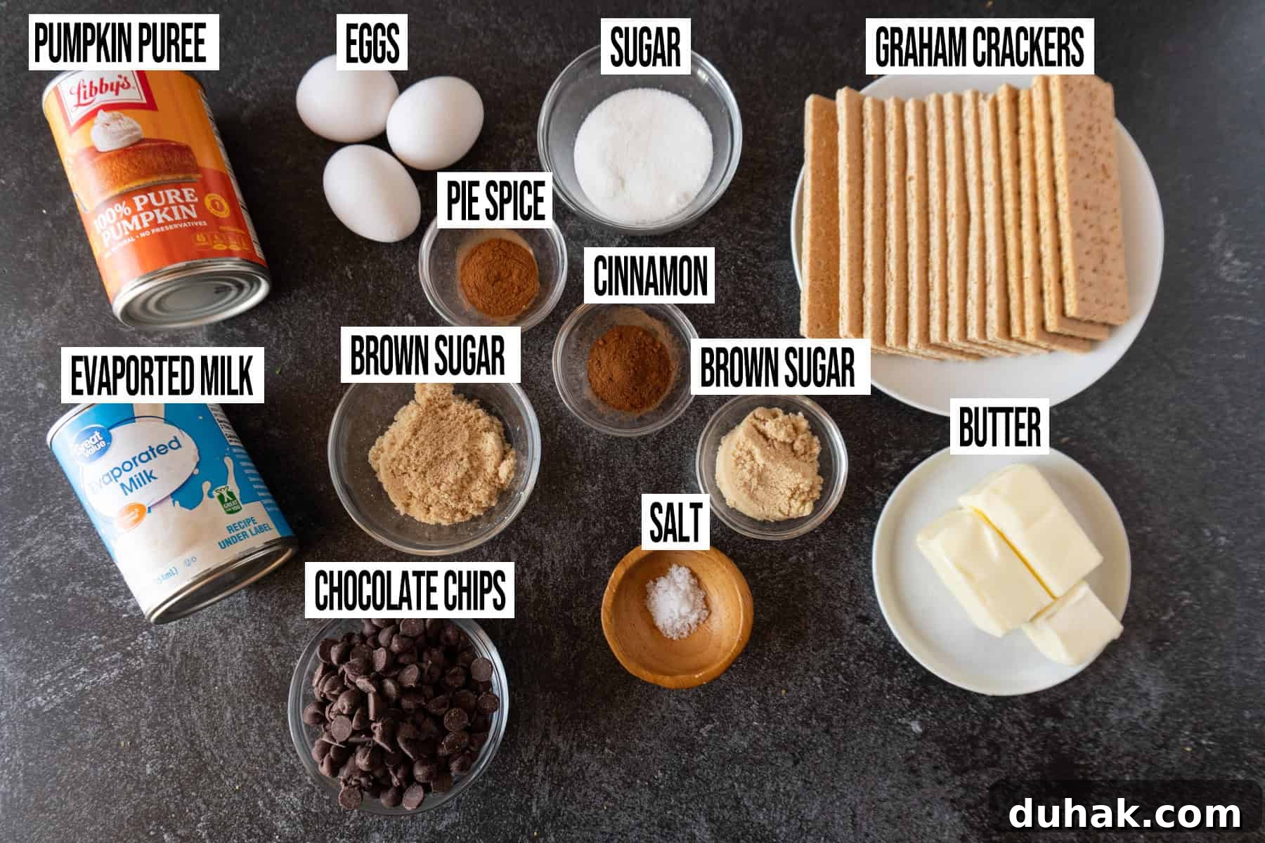 Decadent Chocolate Pumpkin Pie Recipe for Fall Desserts 3 Chocolate pumpkin pie ingredients laid out and in individual bowls and labeled.