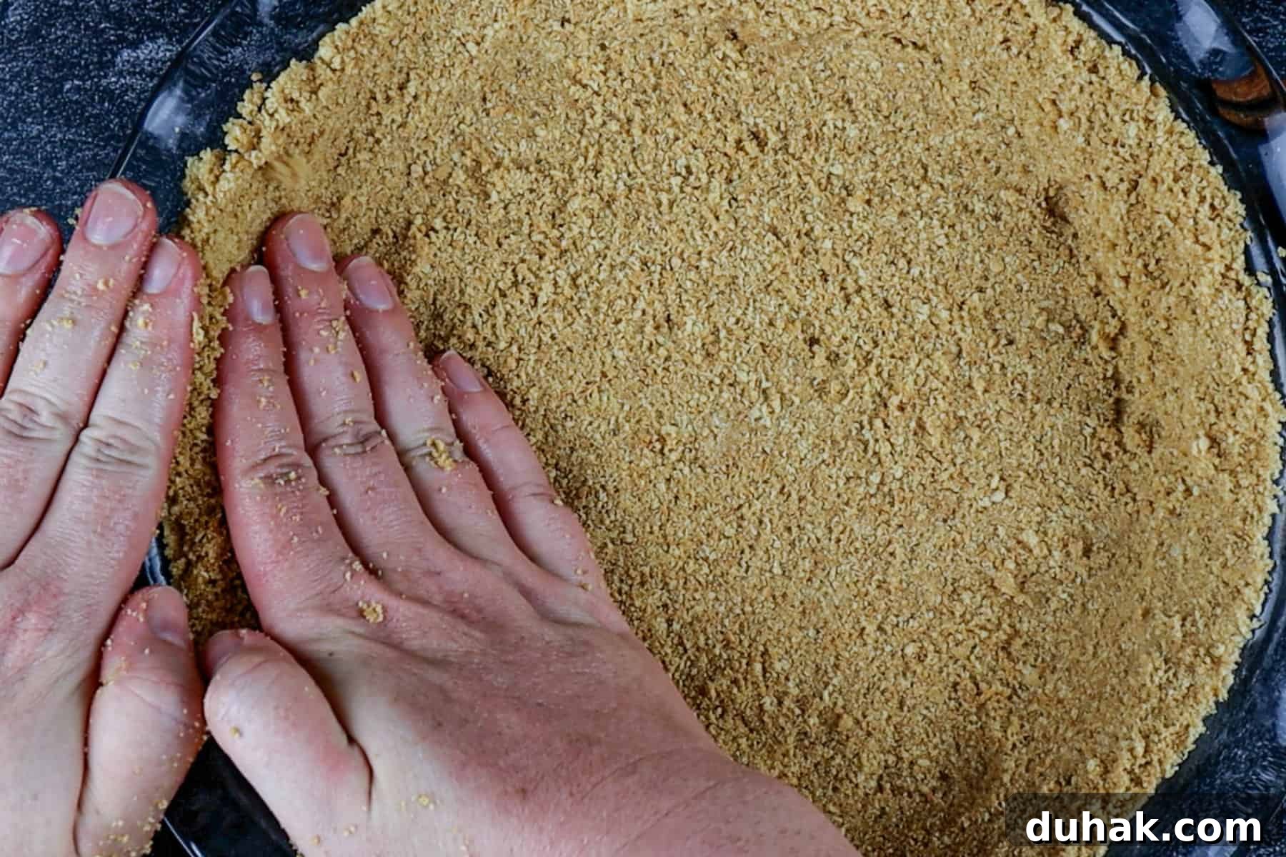 Decadent Chocolate Pumpkin Pie Recipe for Fall Desserts 7 pressing the graham cracker crust into the the pie dish.