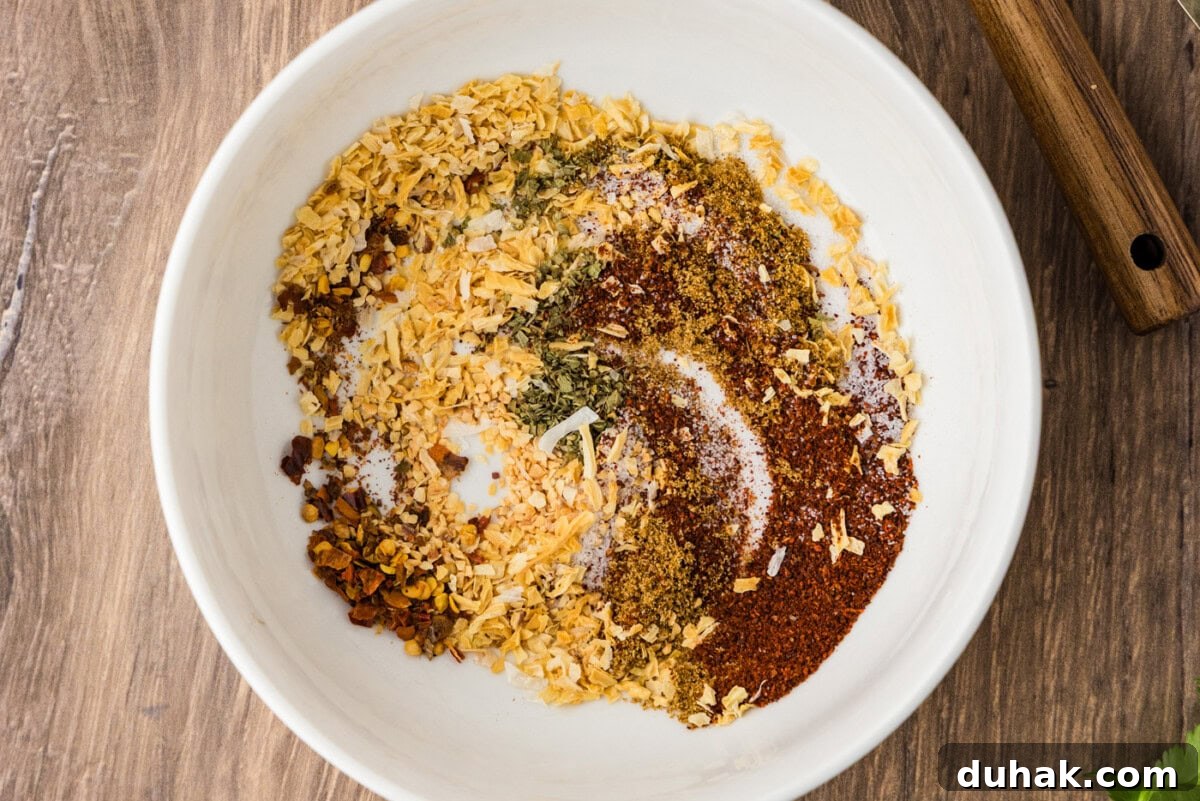 DIY Taco Seasoning Blend for Authentic Mexican Flavor 6 taco seasoning partially mixed in a bowl