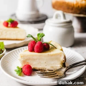 Silky Mascarpone Cheesecake Recipe with Luscious Cream Filling 13 slices of mascarpone cheesecake on plates with forks.