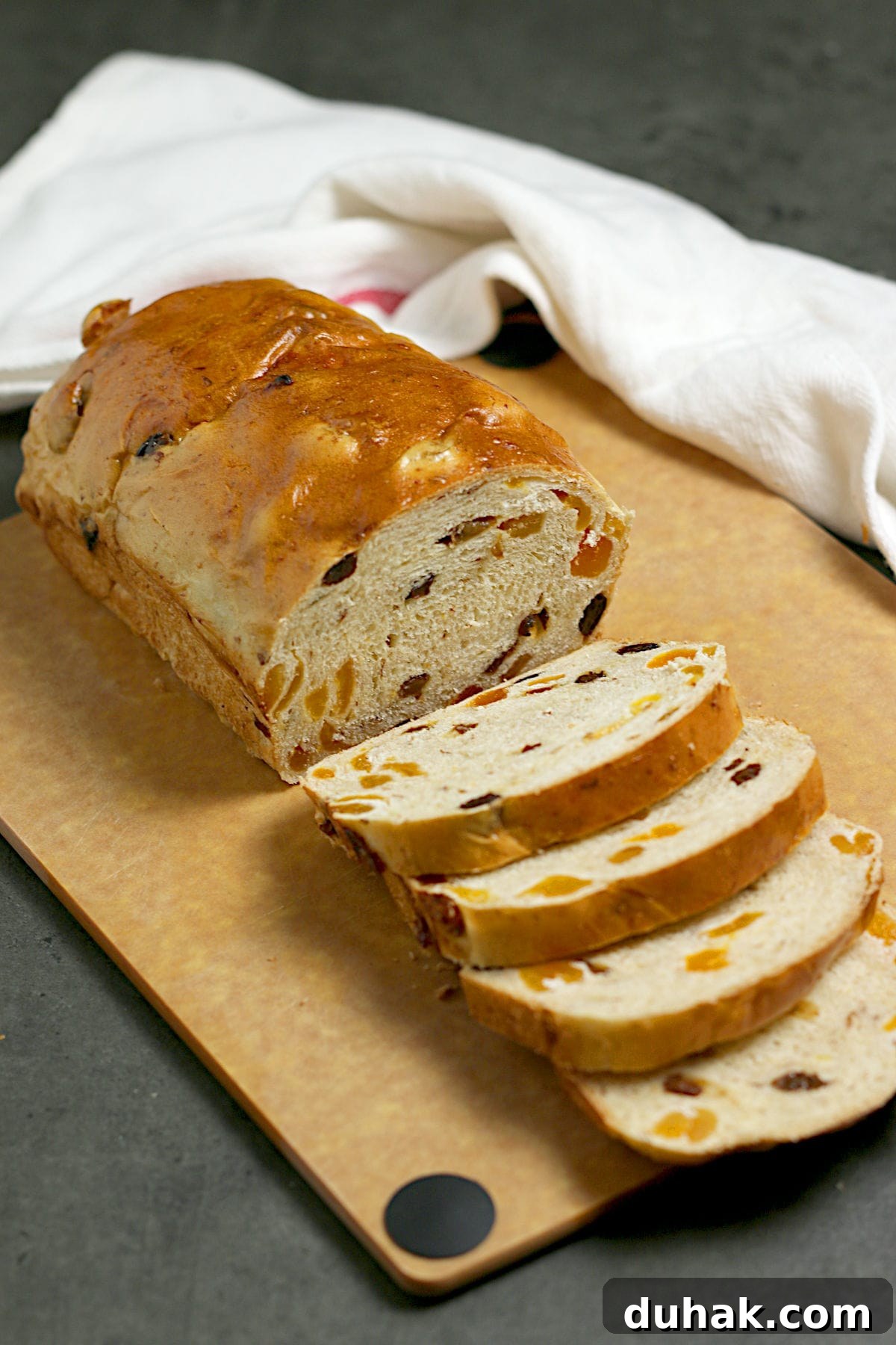 Cinnamon Toast Focaccia Recipe: Crispy Sweet Breakfast Bread 7 A partially sliced loaf of Apricot Raisin Bread