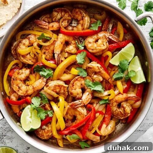 A skillet of a shrimp fajitas recipe.