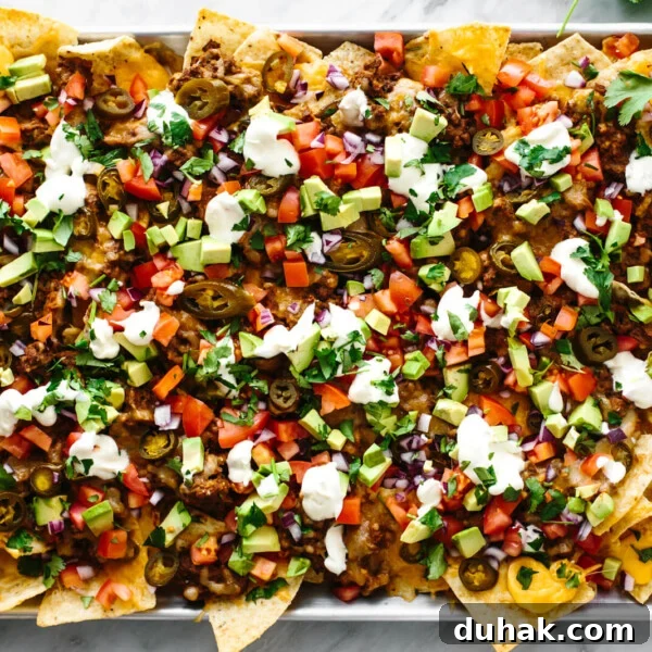 A metal sheet pan with the ultimate nachos