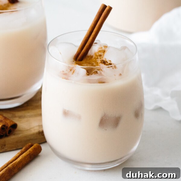 Horchata in a glass with ice.