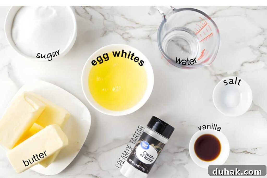 Overhead view of labeled baking ingredients arranged on a marble surface.
