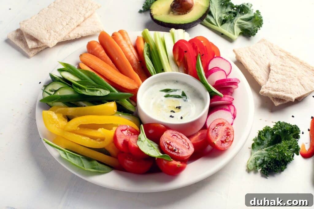 Stop Snacking: Dietitian-Backed Strategies to Curb Cravings 4 A snack plate with veggies and dip.