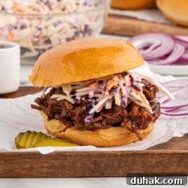 Smoky Texas Brisket Sandwich Recipe for Tender Pulled Beef 11 close up shot of a Brisket Sandwich with slaw