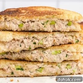 Smoky Texas Brisket Sandwich Recipe for Tender Pulled Beef 7 close up shot of Tuna Melt sandwiches stacked on top of each other