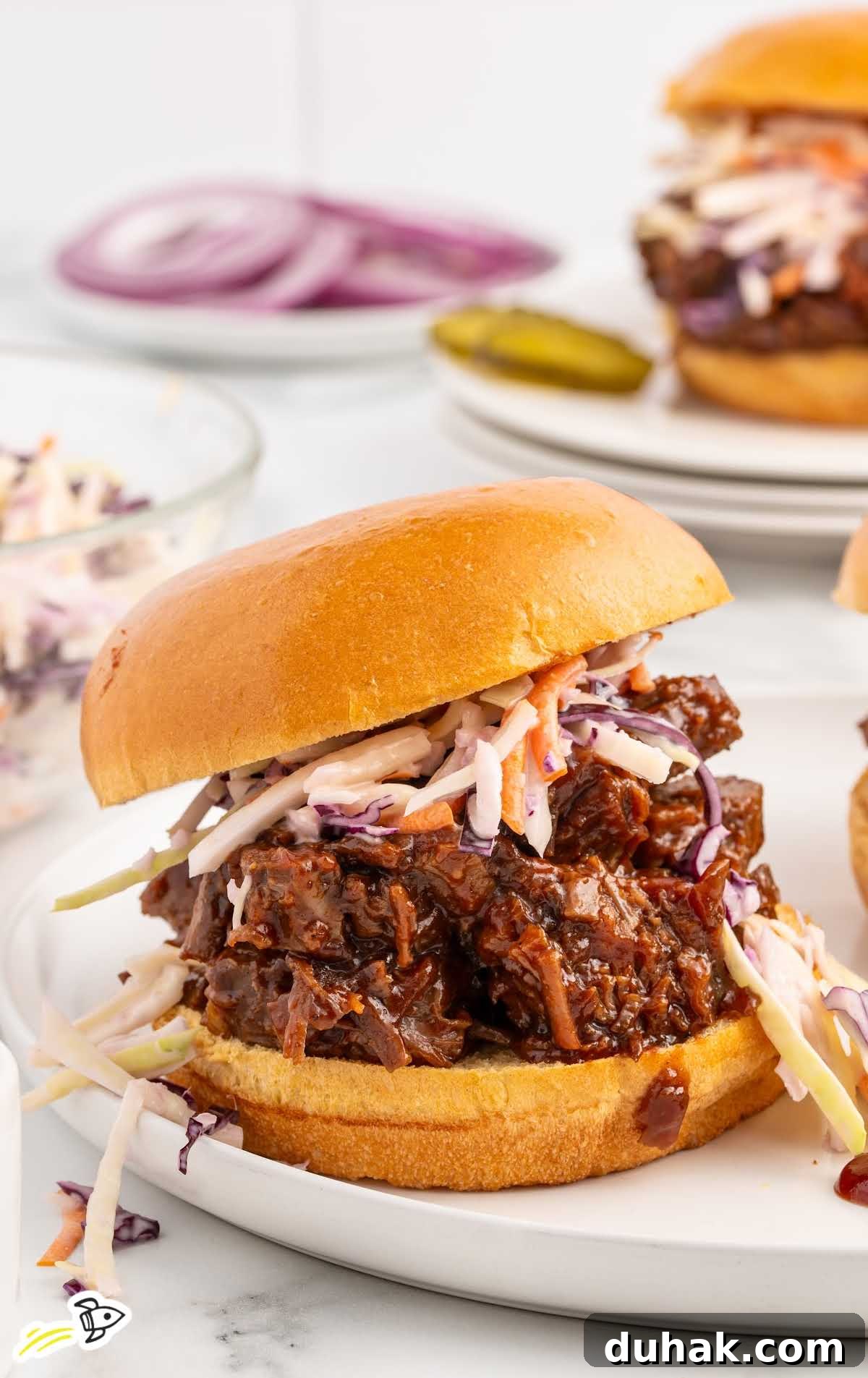Smoky Texas Brisket Sandwich Recipe for Tender Pulled Beef 8 close up shot of a Brisket Sandwich with slaw