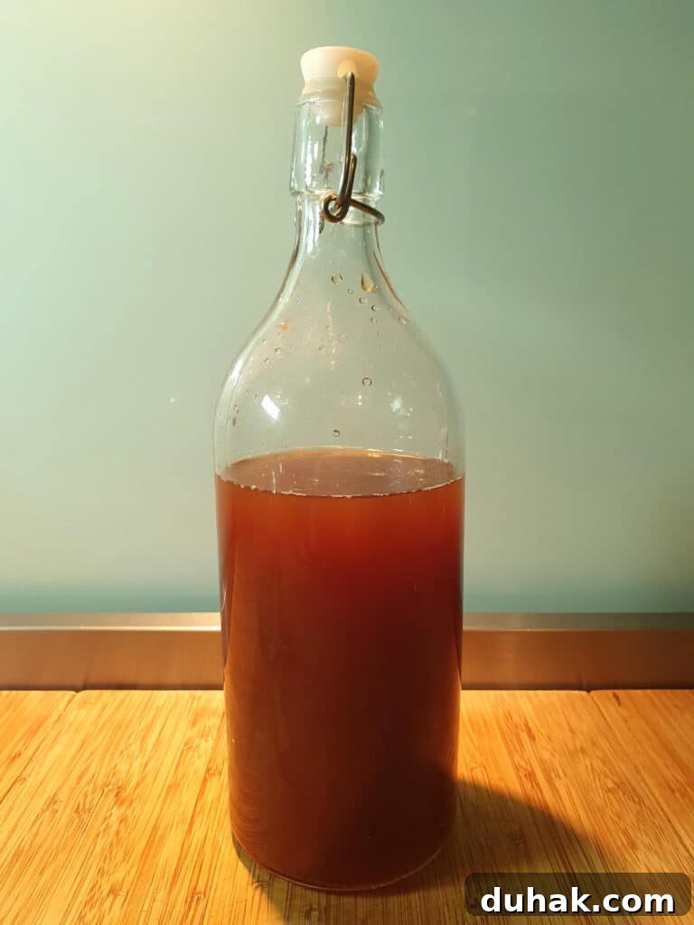 How to Make Homemade Cola Soda from Scratch 16 cola in jug with lid for storage in fridge