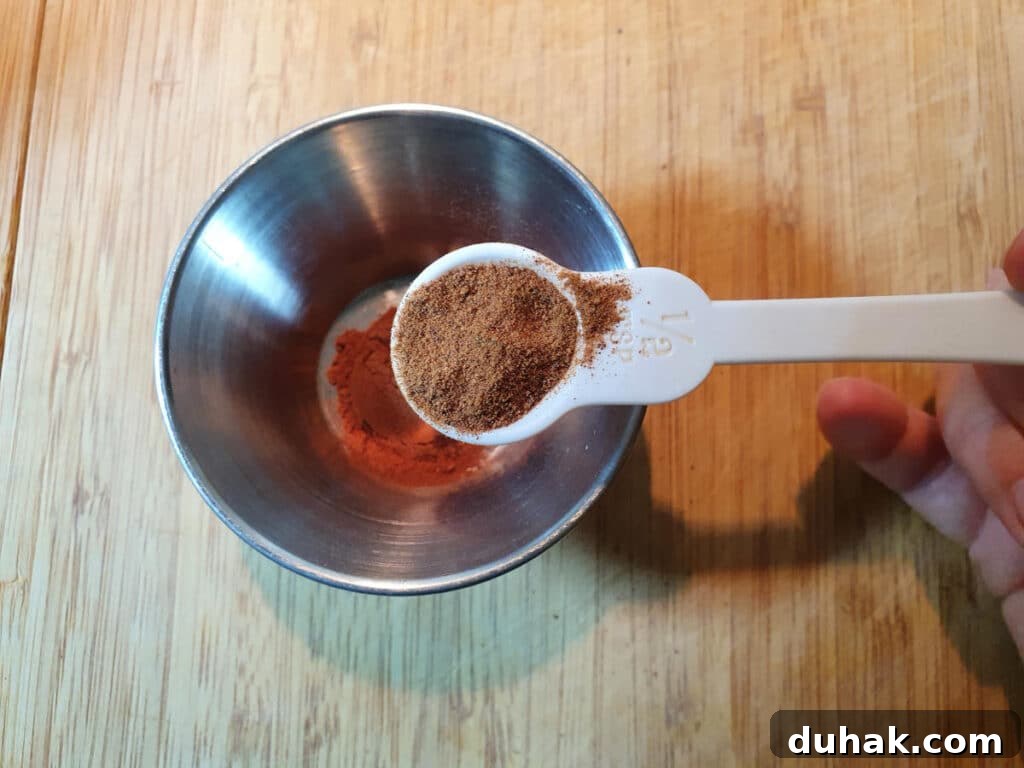 How to Make Homemade Cola Soda from Scratch 8 Measuring nutmeg into a small bowl.