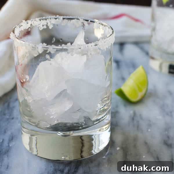Sparkling Cara Cara Orange Margaritas — Festive Citrus Cocktail Recipe 6 cocktail glass filled with crushed ice and a salt rim.
