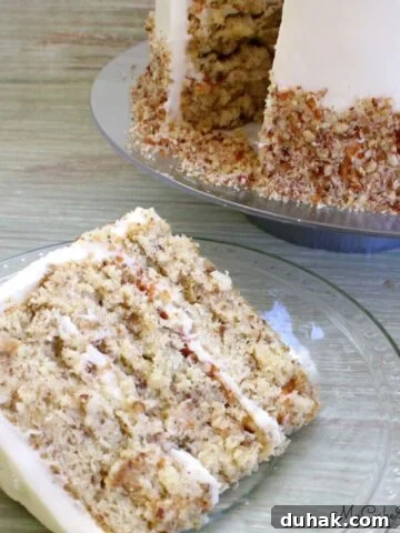 Slice of Italian Cream Cake on a plate.