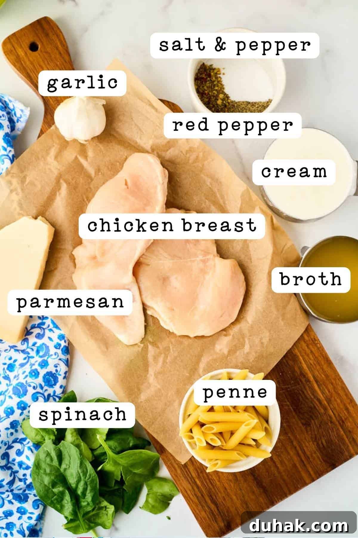 One-Pan Creamy Chicken and Spinach Pasta Skillet 8 ingredients on cutting board