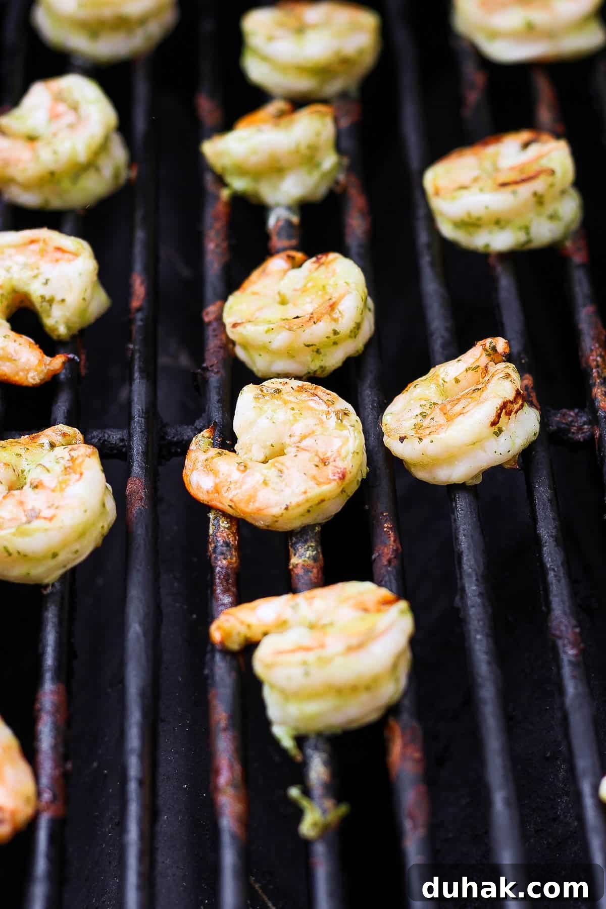 Cilantro-Lime Shrimp Bowl with Creamy Cilantro-Lime Sauce 7 Marinated shrimp cooking on the grill grates.