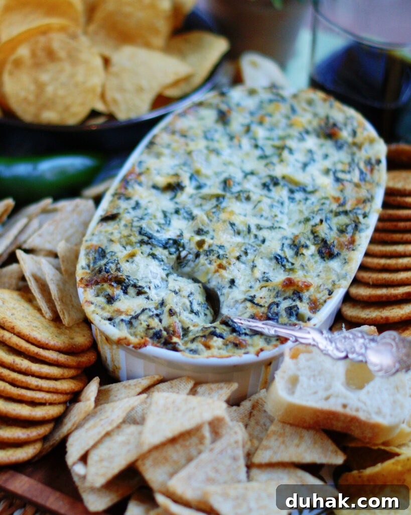 Dorito King Ranch Chicken and Savory Quiche Meal Plan (Monday Menu 190) 12 Creamy baked jalapeño artichoke dip with spinach and cream cheese is a hot, melted dip in a shallow white baking dish.
