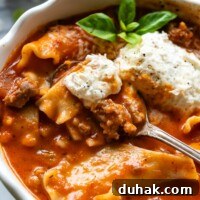 30-Minute Gluten-Free Lasagna Soup Recipe — Hearty & Homemade 8 Gluten-Free Lasagna Soup displayed in a white bowl with a garnish of greenery and a spoon.