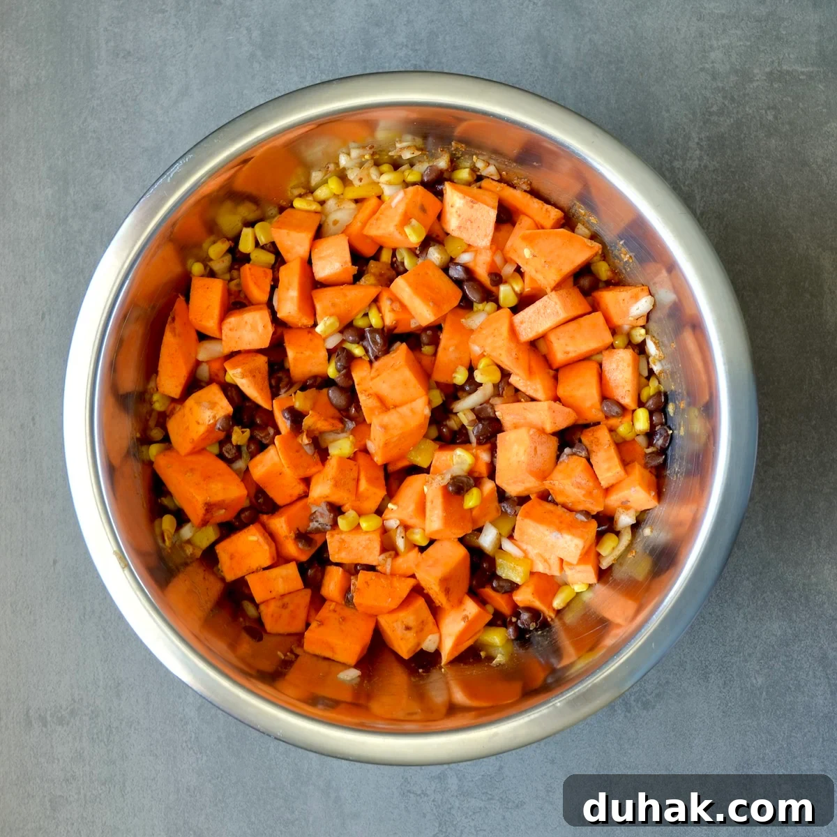 Mixing vegetables with seasonings