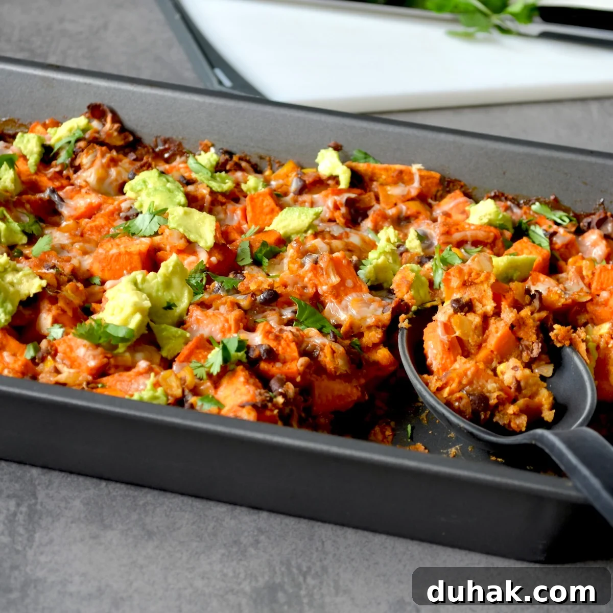Serving sweet potato enchilada casserole