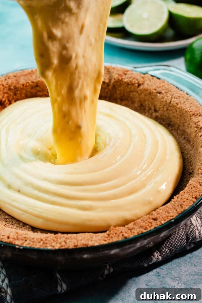 The filling being poured into the baked crust.