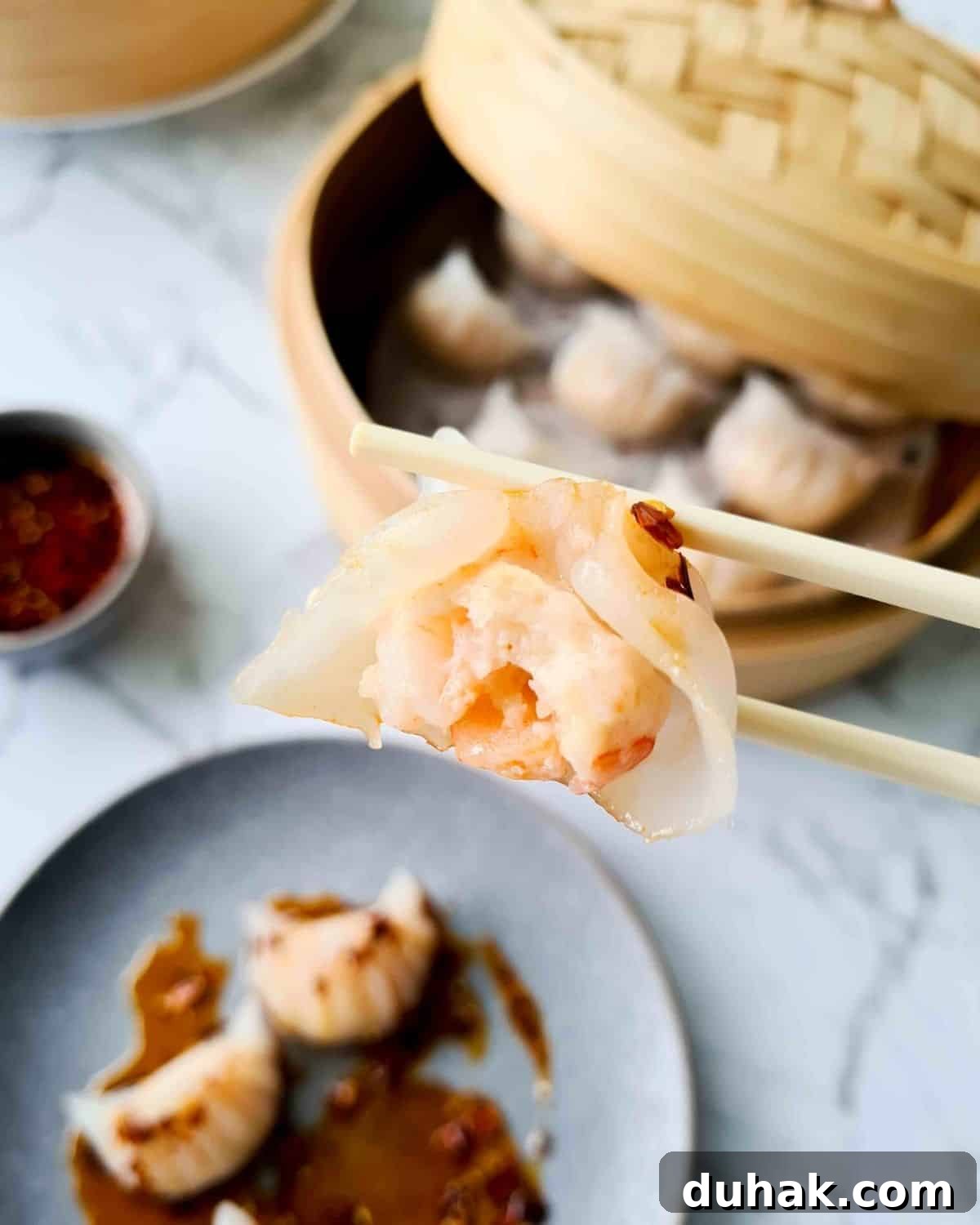 Close up of a half bitten prawn dumpling
