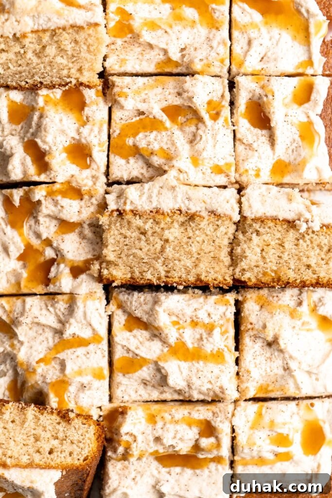 Bourbon Eggnog Sheet Cake with fluffy eggnog frosting, drizzled with caramel sauce
