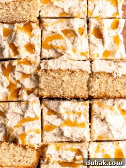 Bourbon Eggnog Sheet Cake with fluffy eggnog frosting, drizzled with caramel sauce