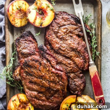 Grilled Ribeye with Caramelized Peaches and Herb Butter 9 grilled ribeye steaks with peaches www.thecuriousplate.com