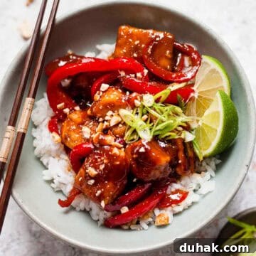 7-Day Aldi Budget Meal Plan: Dec 21–27 Weekly Menu 6 Sticky chicken with peppers and peanuts in a bowl with rice.