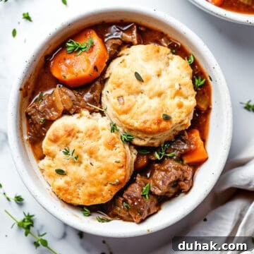 7-Day Aldi Budget Meal Plan: Dec 21–27 Weekly Menu 7 Beef cobbler with cheddar biscuits- slow cooker beef in a bowl.