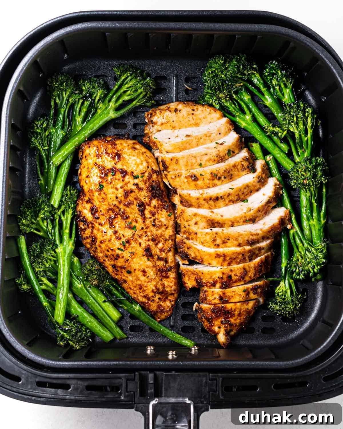 Crispy Juicy Air Fryer Chicken Breast Recipe in 20 Minutes 6 air fried chicken breasts in air fryer basket.