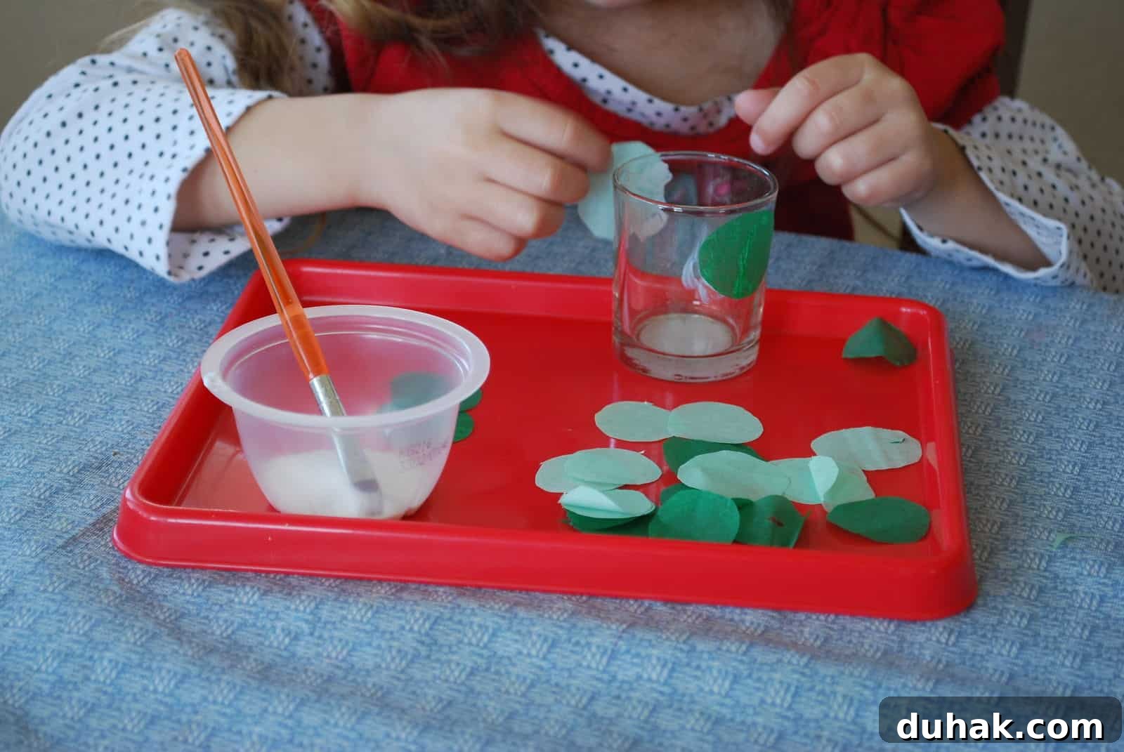 St. Patrick’s Day Votive Candle Craft Ideas 5 child gluing circles on glass votive