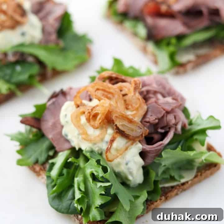 A open roast beef sandwich on a plate