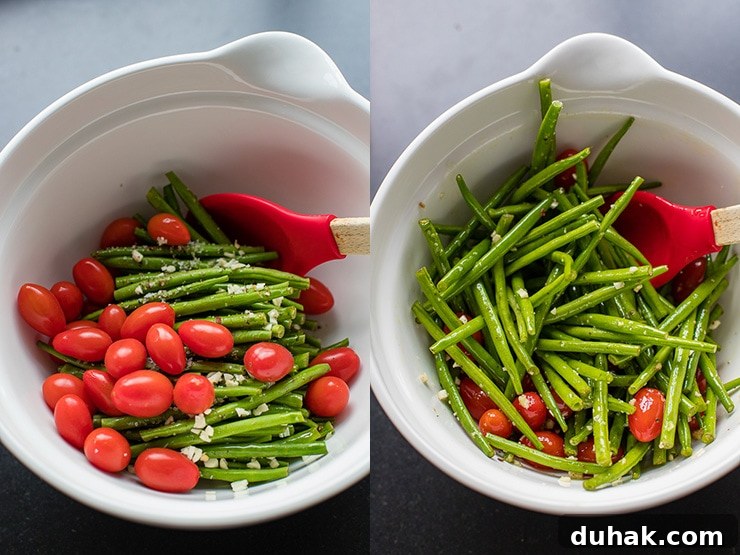 One-Pan Italian Sausage with Roasted Vegetables 4 Garlic-seasoned green beans and cherry tomatoes mixed in a white bowl.