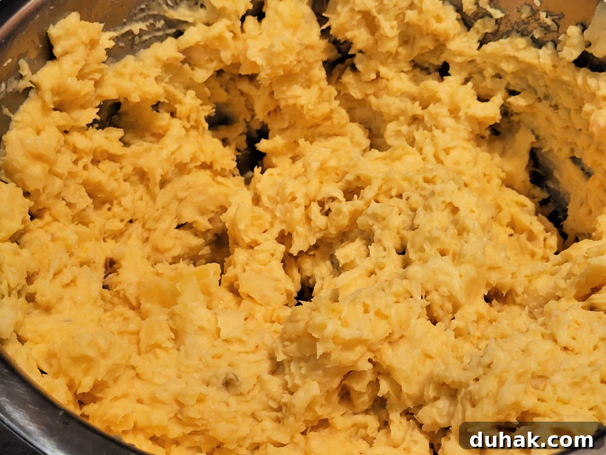 Smoked Sweet Potato Casserole with Brown Sugar Pecan Topping 5 Mashed Smoked Sweet Potatoes In Bowl
