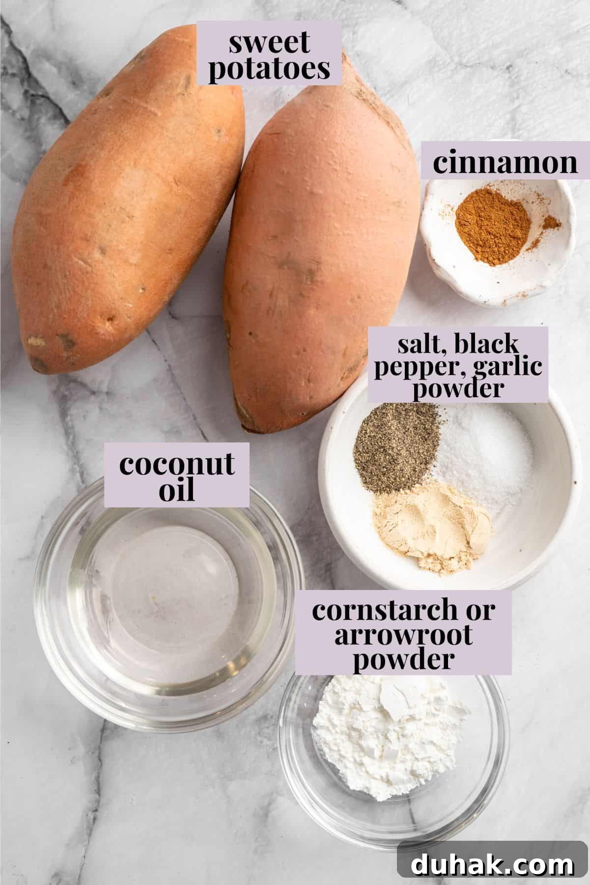 An easy trick guarantees that these sweet potato fries turn out super crispy, even baked in the oven. You'll never make them any other way! Overhead view of ingredients for sweet potato fries with labels