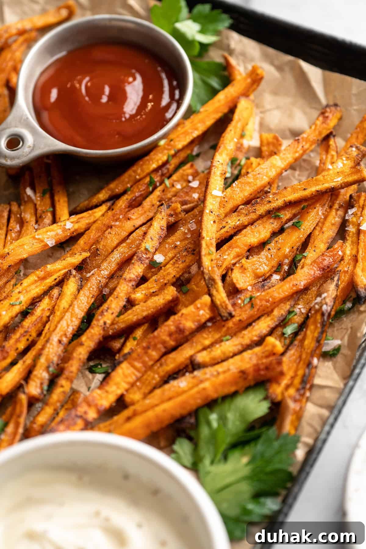Sheet pan of crispy sweet potato fries Sheet pan of crispy sweet potato fries