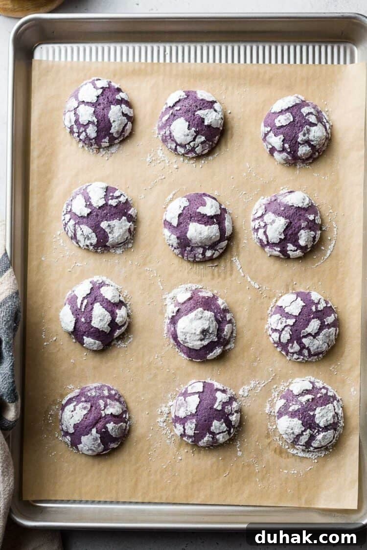 Ube Crinkle Cookies on a baking sheet.