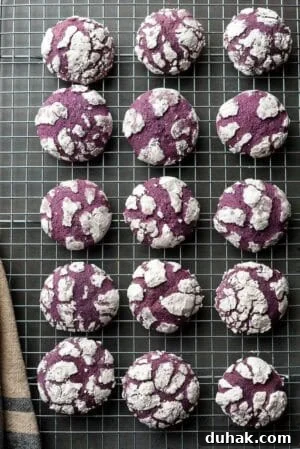 Ube Crinkle Cookes on a wire rack.
