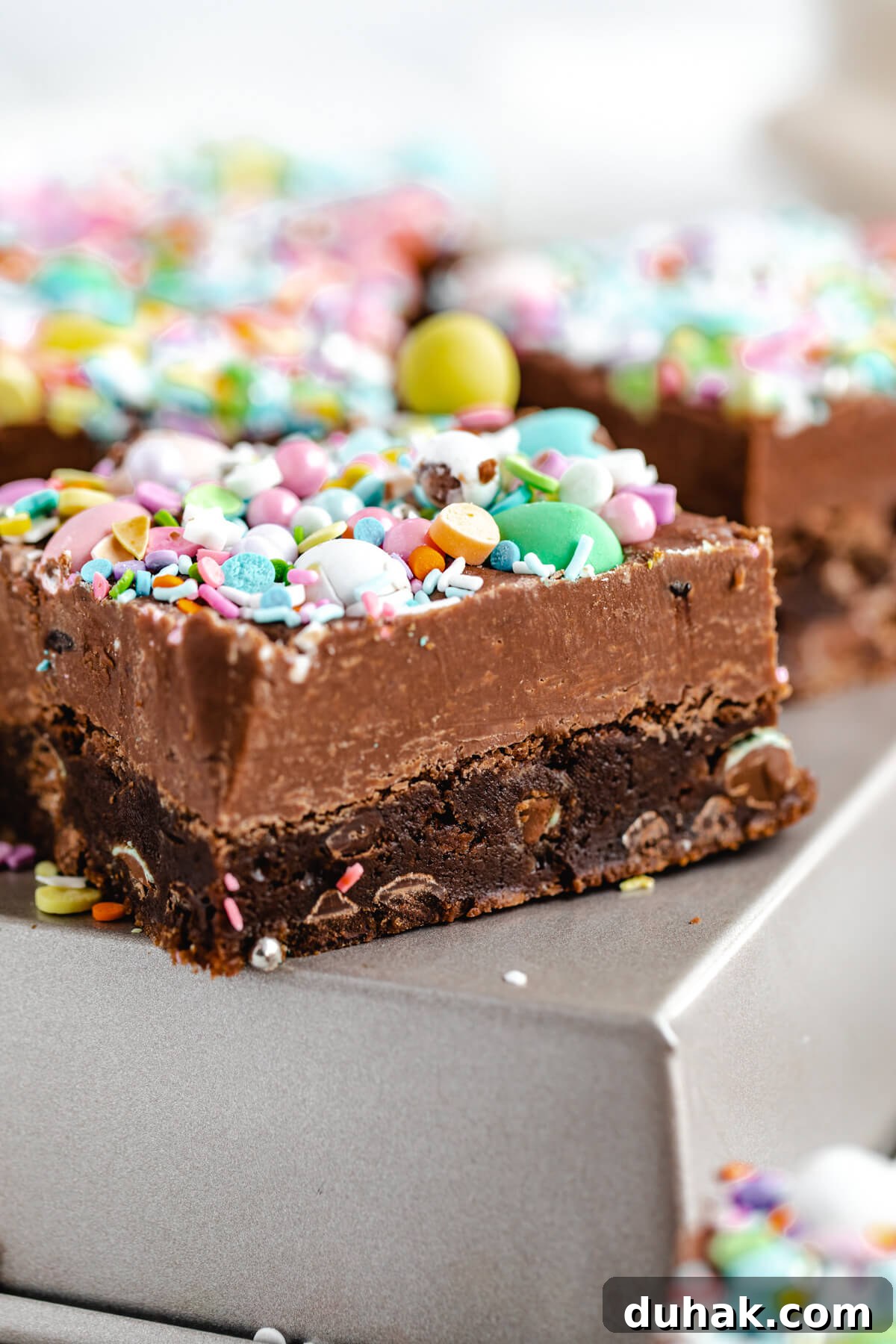 Malted Milk Chocolate Easter Egg Fudge Brownies Recipe 5 close up of fudge brownie on a square cake pan